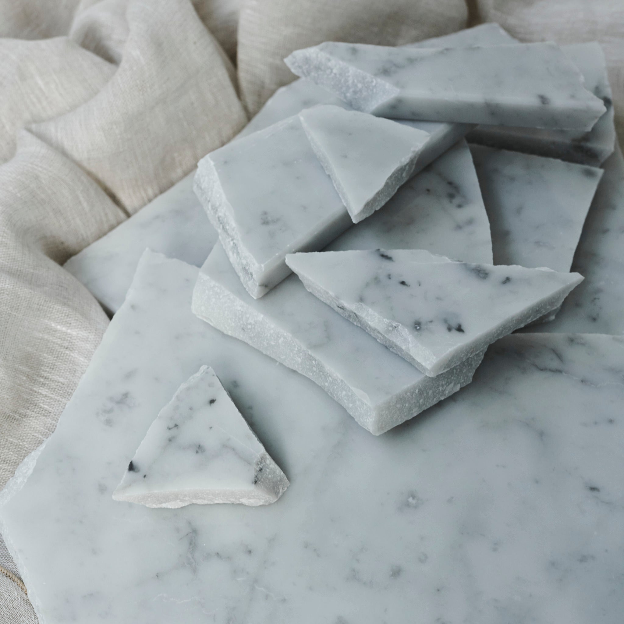 Glossy sample of Carrara Bianco marble with gray veining, showcasing the elegant natural stone from My Store.