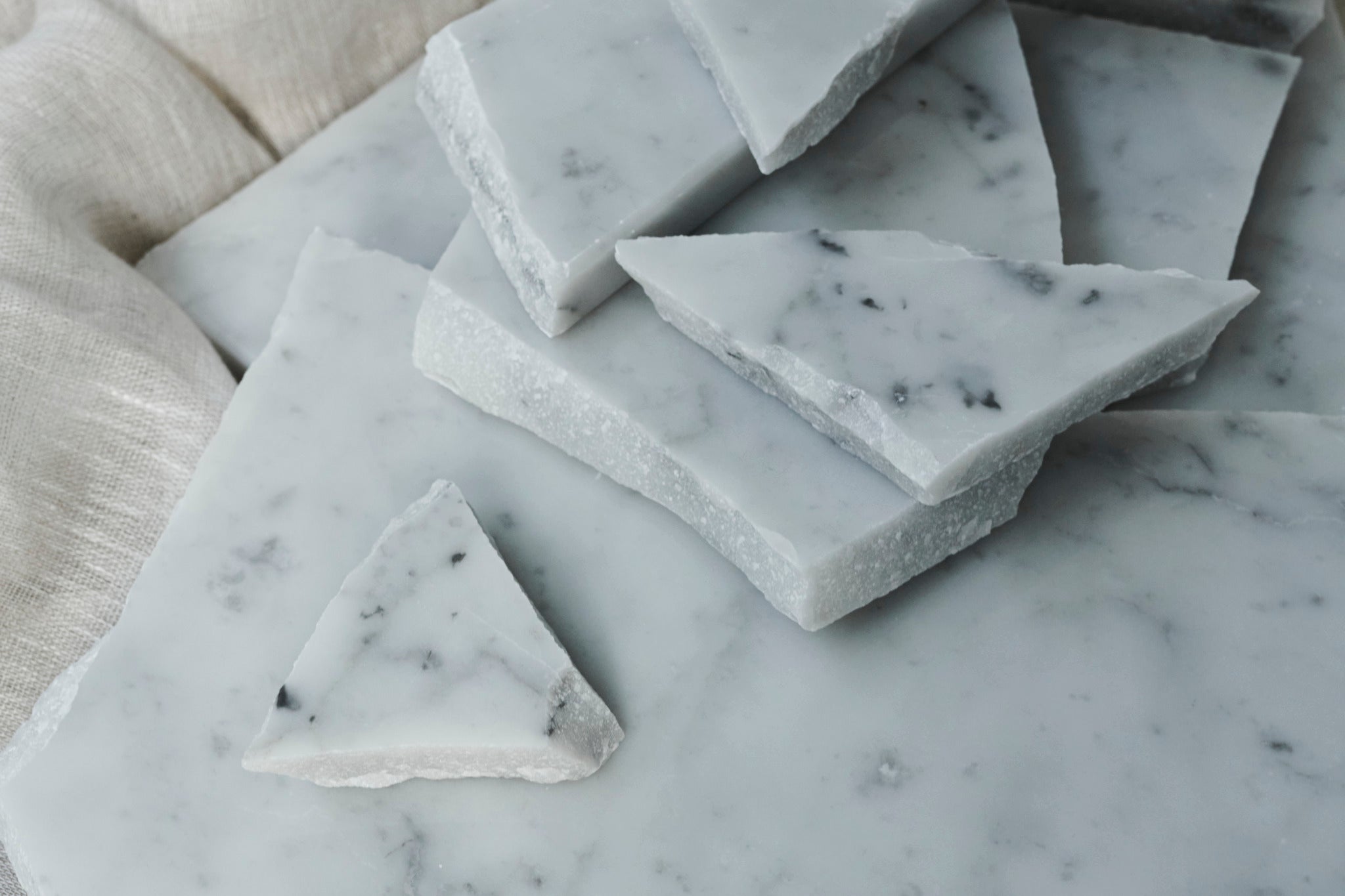 Glossy sample of Carrara Bianco marble showcasing white and gray veining, from My Store.