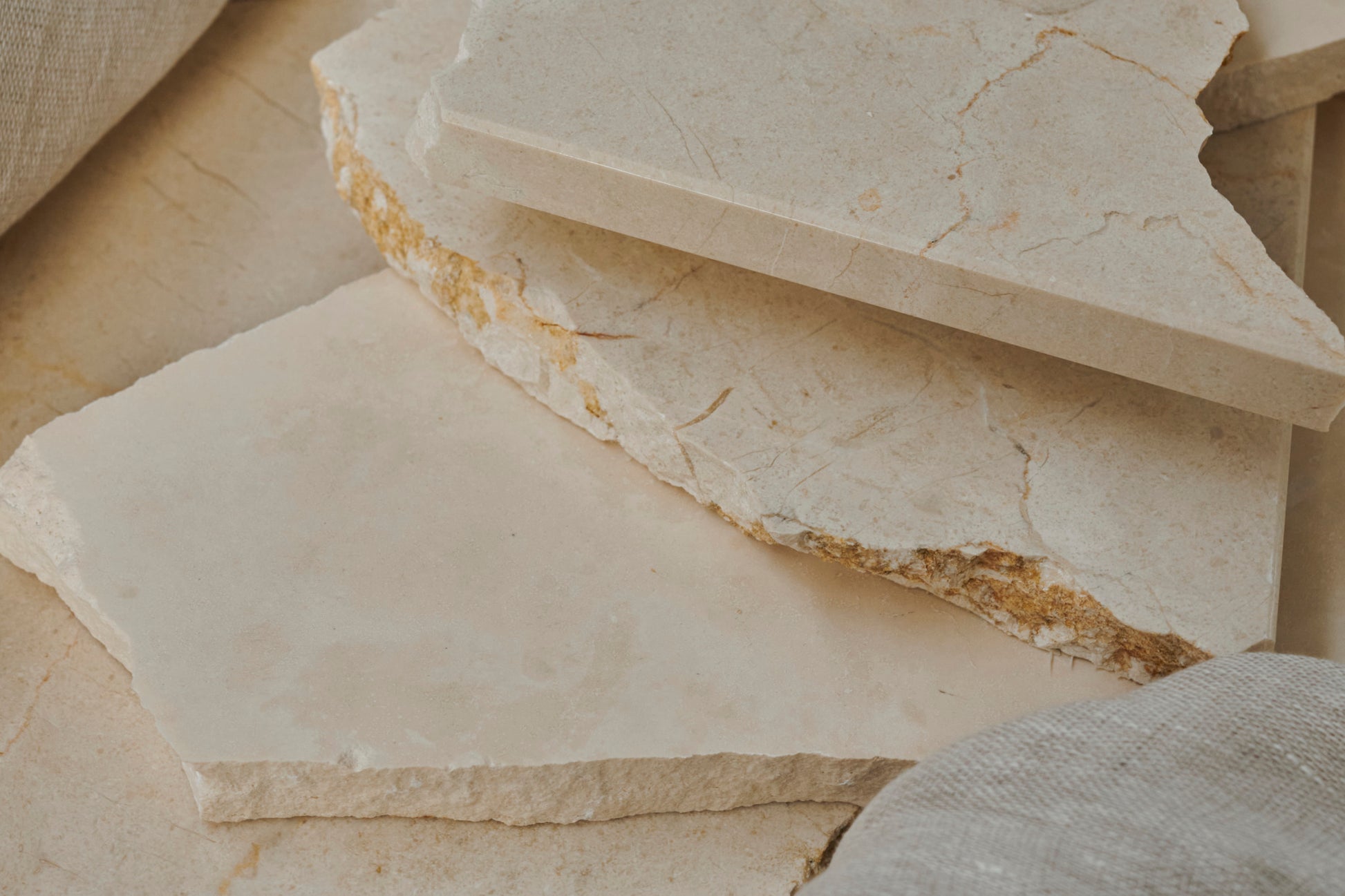 Glossy sample of Crema Marfil marble from My Store, showcasing warm beige tones and smooth polished surface.