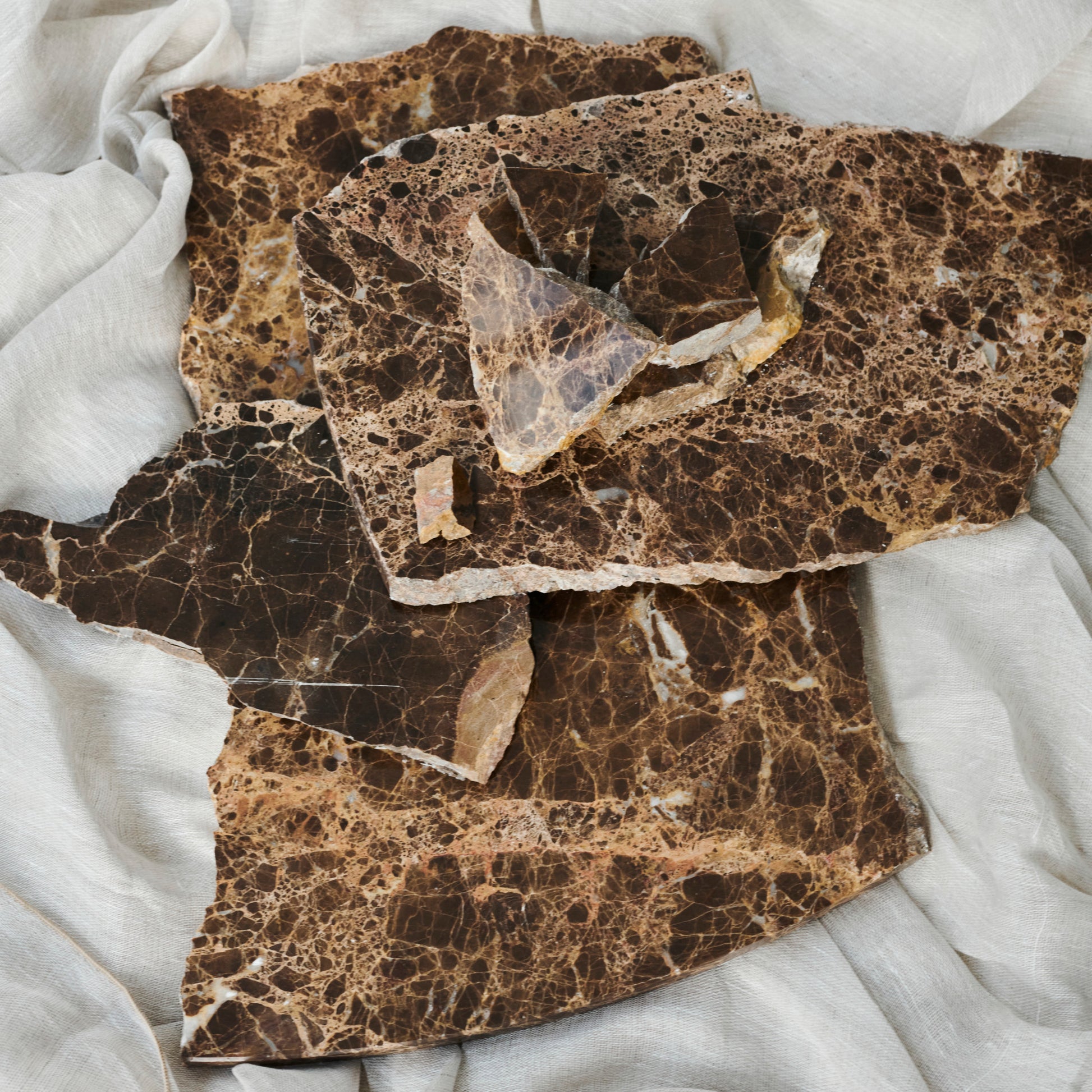 Dark Emperador marble sample from My Store showing glossy, rich brown and gold veined natural stone texture.