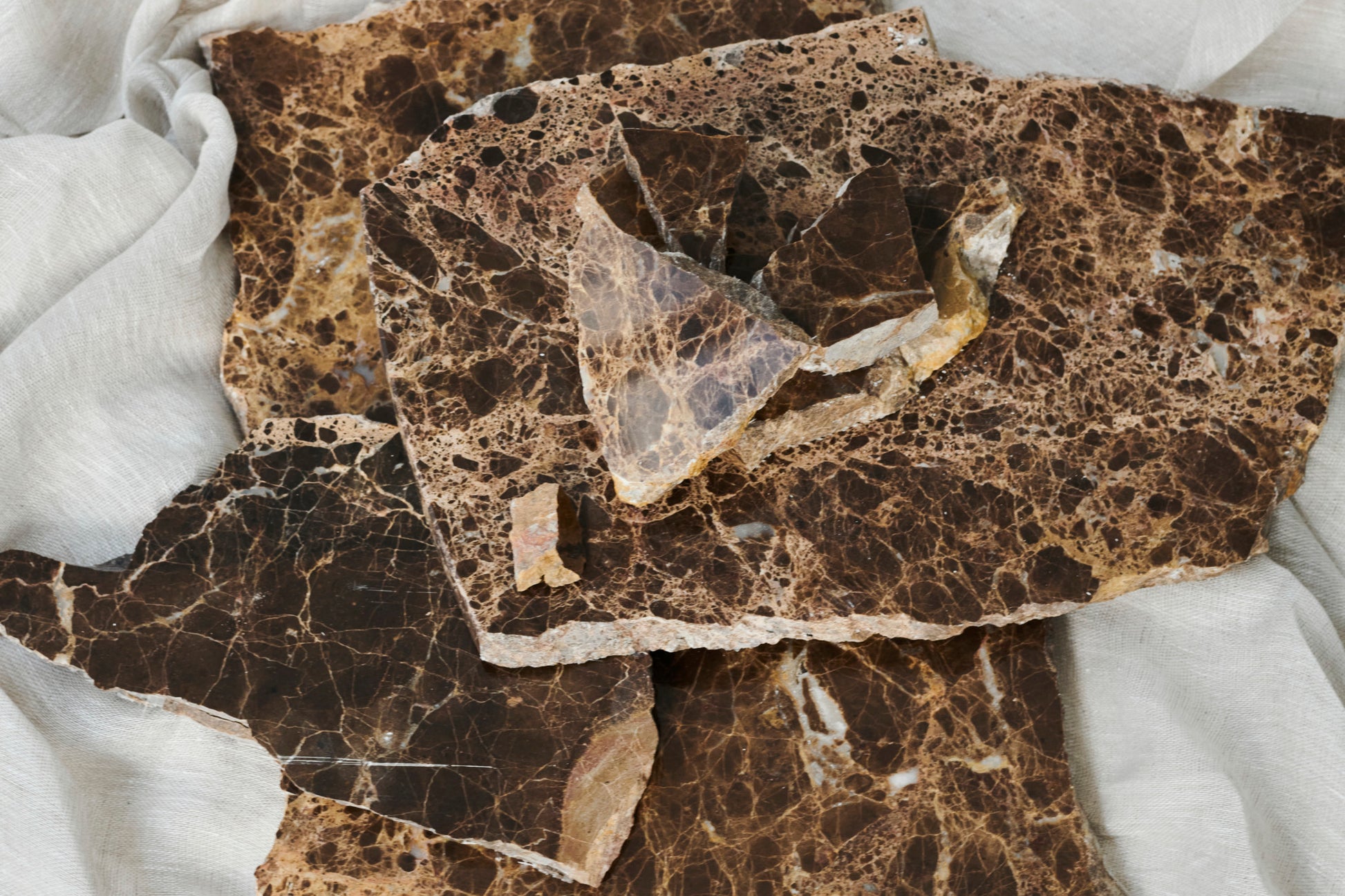 Dark Emperador marble sample from My Store showing glossy, rich brown and beige veined surface for luxurious interior design.