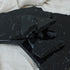 Glossy Nero Marquina marble sample from My Store showing deep black surface with white veining and polished finish.