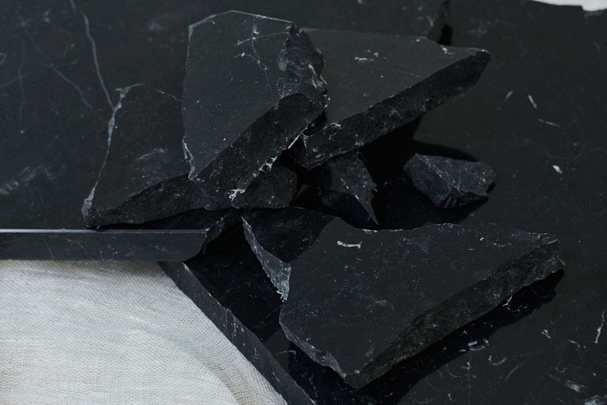 Glossy Nero Marquina marble sample from My Store, showcasing deep black surface with white veining for luxury interior design.