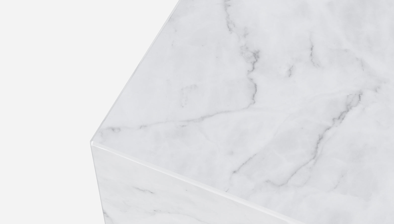 White marble cube made from Bianco Carrara marble with a matte finish, showcasing smooth surfaces and natural veining.