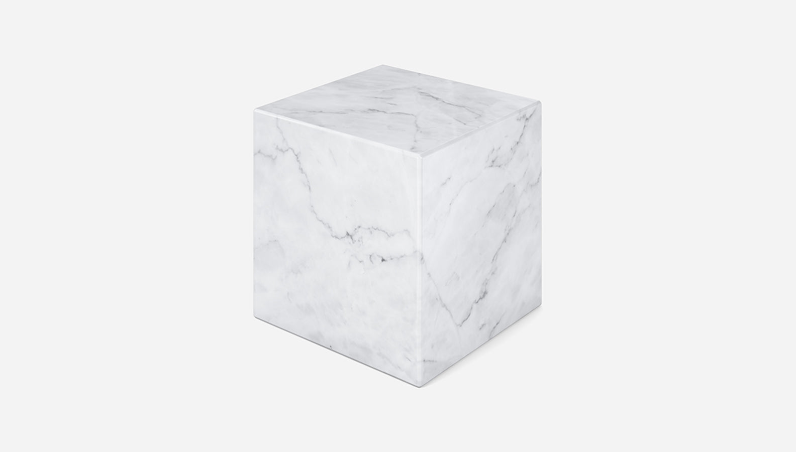 White marble cube made from Bianco Carrara marble, showcasing natural veining and smooth matte finish.