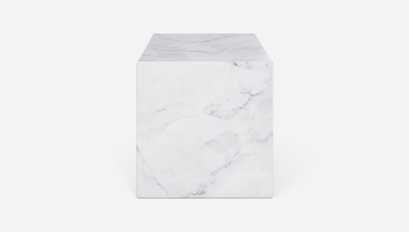 White Bianco Carrara marble cube with matte finish, showcasing smooth surface and natural veining details.