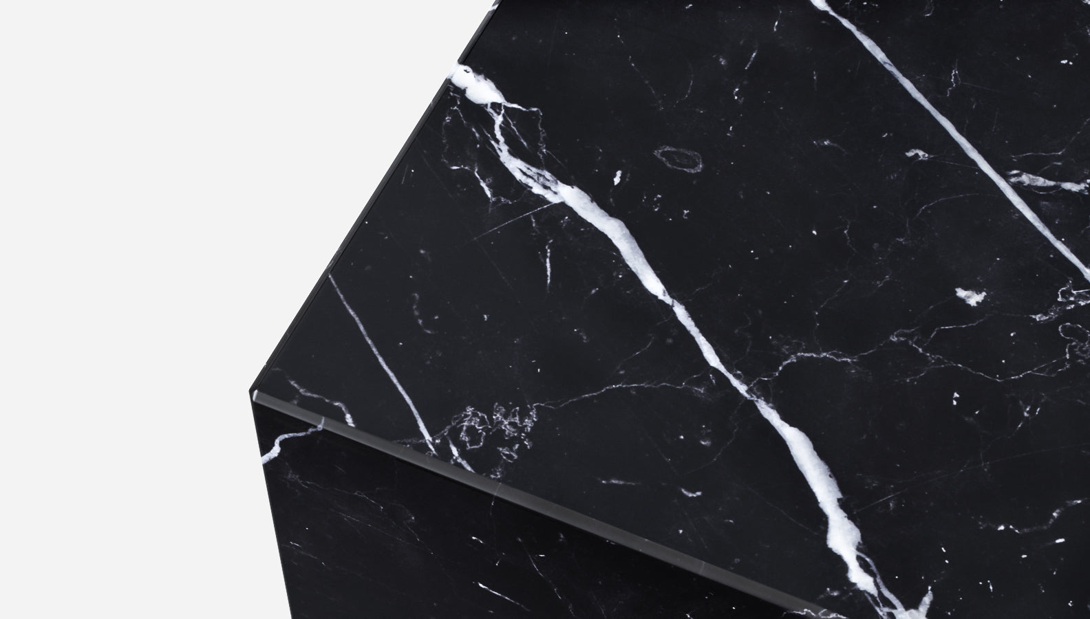 Marble cube made of Nero Marquina black marble with a matte finish, showcasing elegant veining and smooth surfaces.