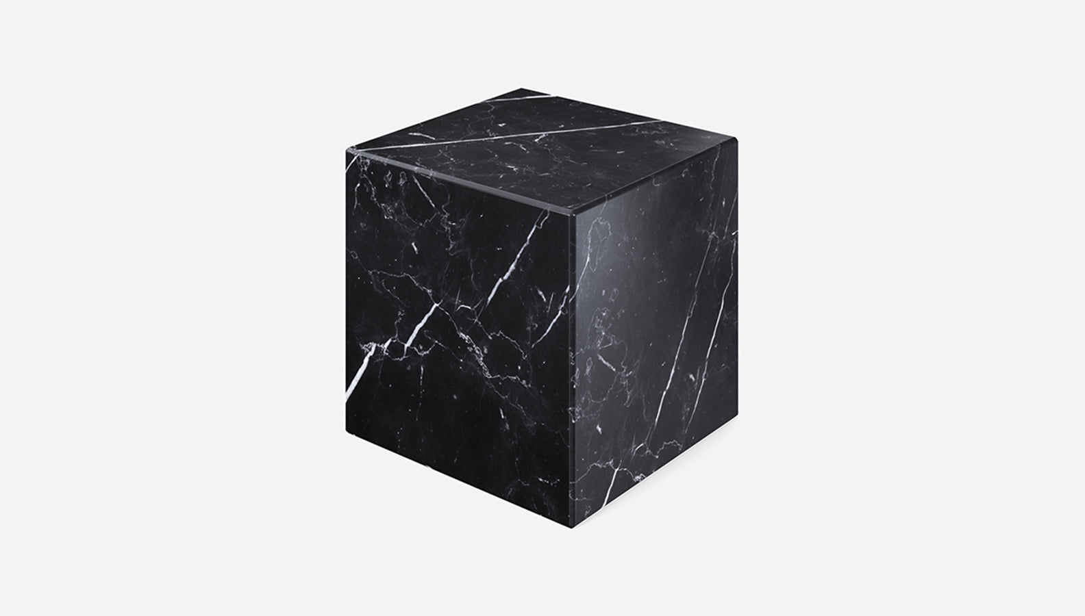 Black Nero Marquina marble cube with matte finish, showcasing smooth surfaces and sharp edges, natural stone texture visible.