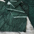 Sample India Green marble tile with matte finish, showcasing lush green and white veining for elegant interior surfaces.