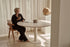 KIYO round dining table with Crema Altea marble top and black center-leg, stylish and modern for contemporary dining spaces.