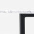 Glossy round marble dining table with white Bianco Carrara marble top and cross metal frame, modern and elegant design.