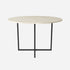 Glossy round marble dining table with Crema Marfil beige surface and cross-frame base, designed for elegant dining spaces.