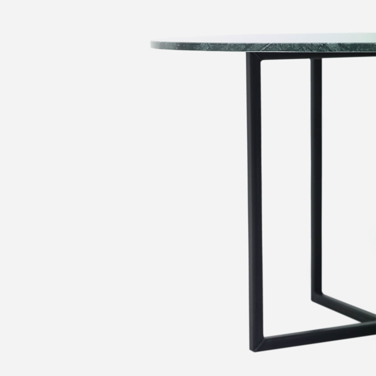 Glossy round marble dining table with India Green marble top and cross-frame base, modern and stylish for dining rooms