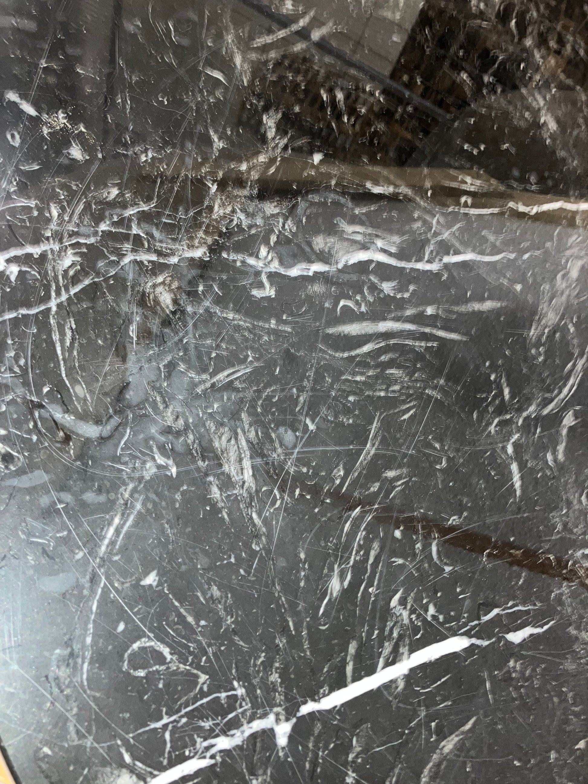 KIYO round dining table by My Store with Nero Marquina black marble surface, 110 cm diameter, glossy finish with small scratches and stains