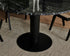 KIYO round dining table in Nero Marquina black marble with black center-leg, matte finish, minor surface scratches visible