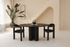 Black oak round dining table named FRANKY with a sleek design, featuring a sturdy base and smooth tabletop surface.