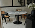 Round KIYO dining table with Bianco Carrara white marble top, black center-leg, and matte finish, 120cm diameter.