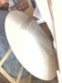 My Store KIYO round dining table with beige Crema Marfil marble top, 140 cm diameter, matte finish and small pit detail.