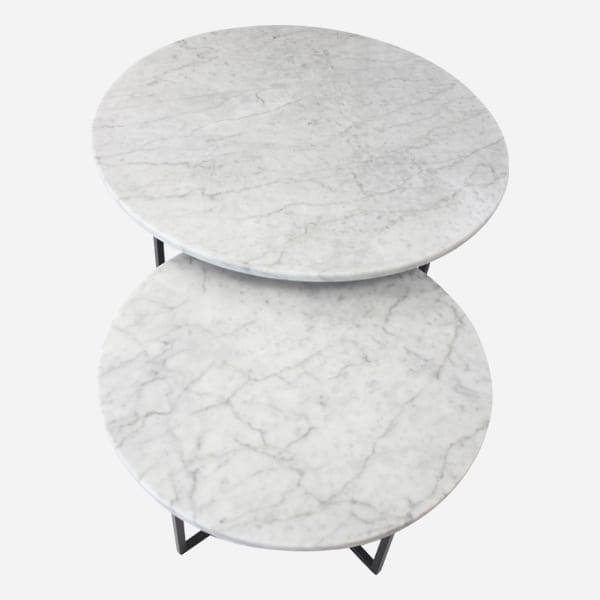 Round marble coffee table set in Bianco Carrara white with matte finish, featuring sleek natural marble surfaces and modern design.
