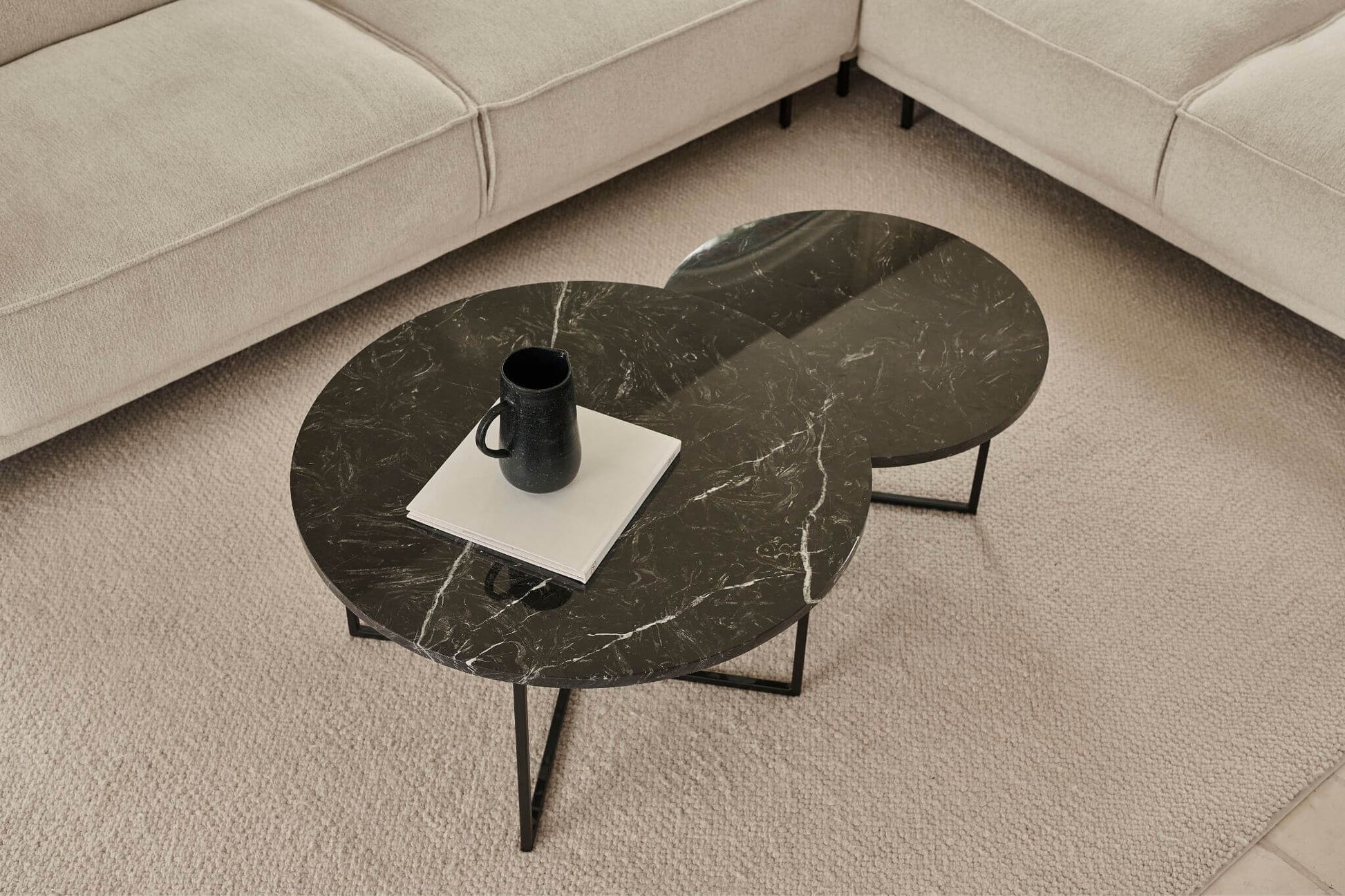 Matte round marble coffee table set with Nero Marquina black marble, featuring sleek black surfaces and modern design.