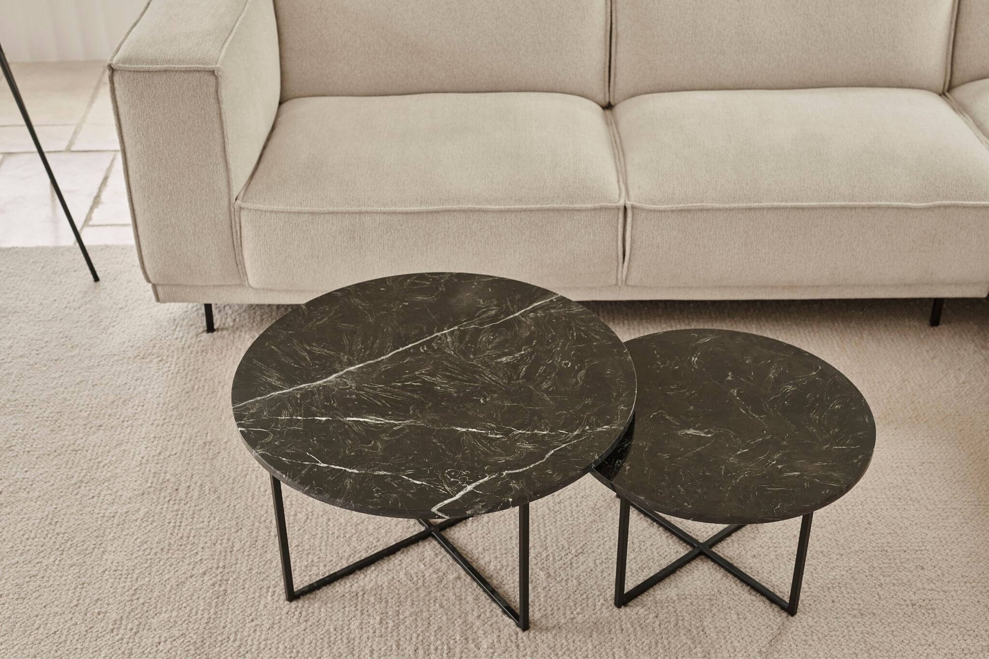 Round Nero Marquina black marble coffee table set with matte finish, featuring sleek, modern design and sturdy metal legs.