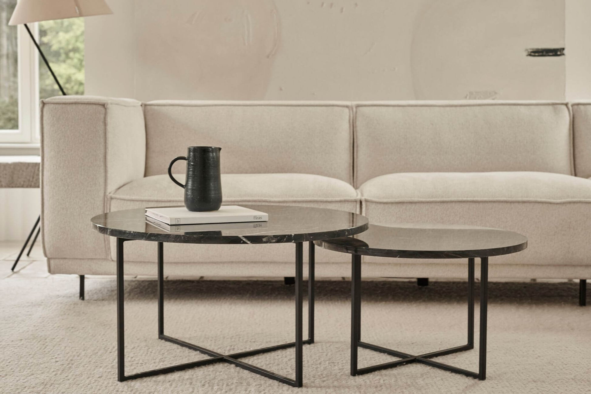 Round marble coffee table set with travertine surface and wooden legs, modern and elegant living room furniture piece