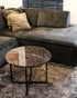 Dark Emperador brown round marble coffee table with glossy finish, smooth surface, and sturdy base.