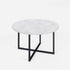Round marble coffee table with glossy Bianco Carrara white surface and sleek metal legs.