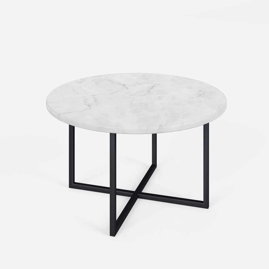 Round marble coffee table with glossy Bianco Carrara white surface and sleek metal legs.