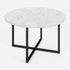 Round marble coffee table with glossy white Bianco Carrara surface and sleek modern design.