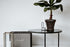 Round marble coffee table with a glossy India Green finish, featuring a sleek design and sturdy base.