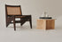 Round LOU coffee table by My Store with a travertine top and wooden legs, showcasing a modern, elegant design.