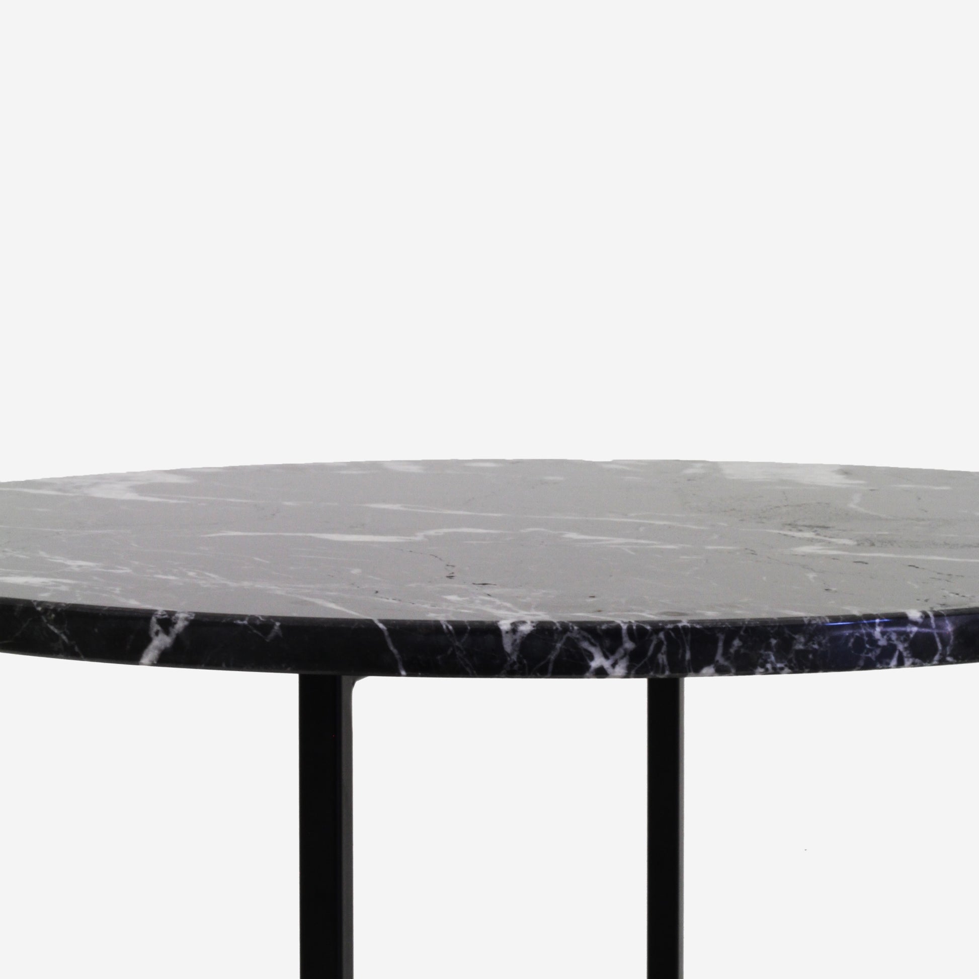 Round Nero Marquina black marble coffee table with glossy finish and subtle surface scratches, modern design from My Store.