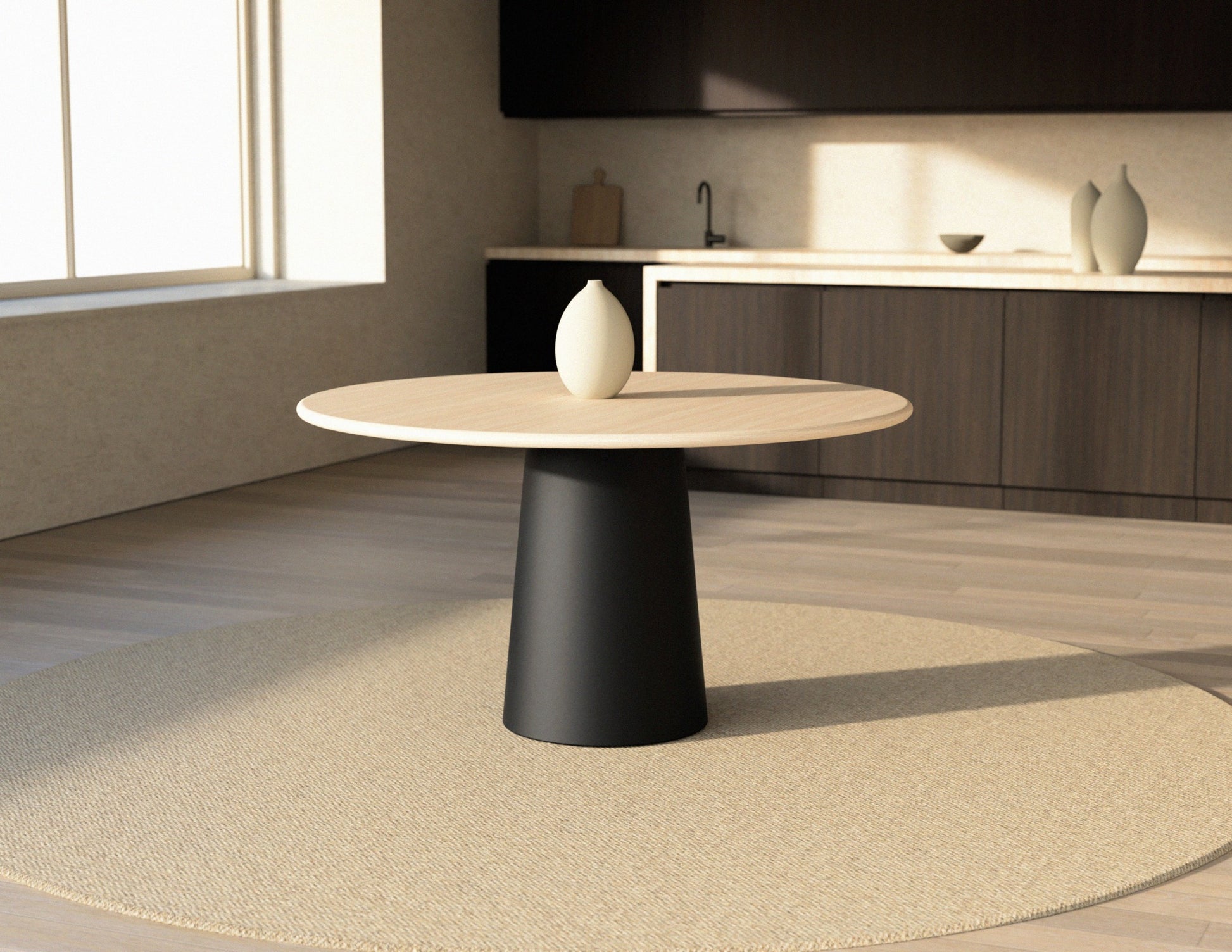 Flow round dining table with ash white oak surface and black cylindrical base, modern and stylish for dining rooms.