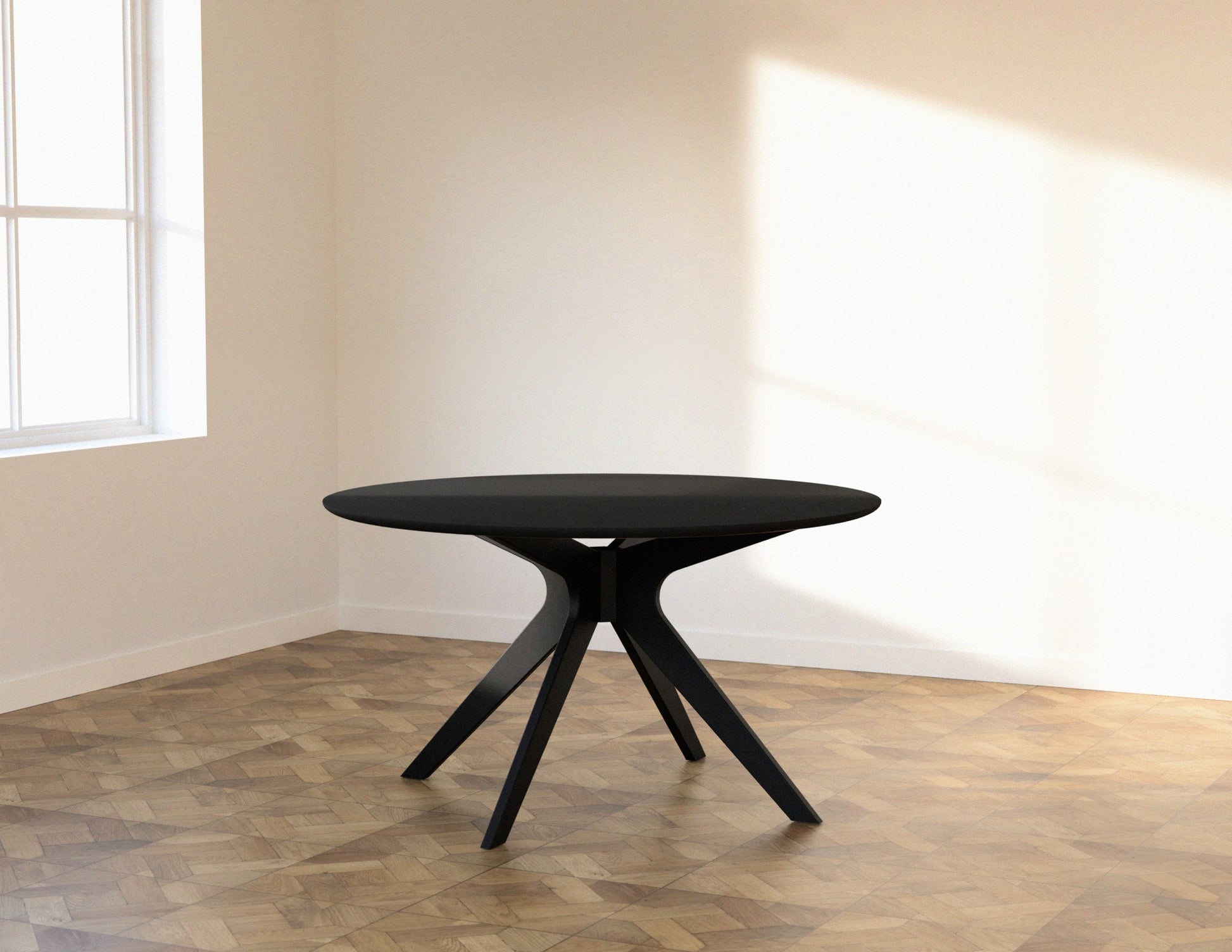 Round oak dining table with charcoal finish and arched frame, showcasing a sturdy and stylish design for modern dining rooms.