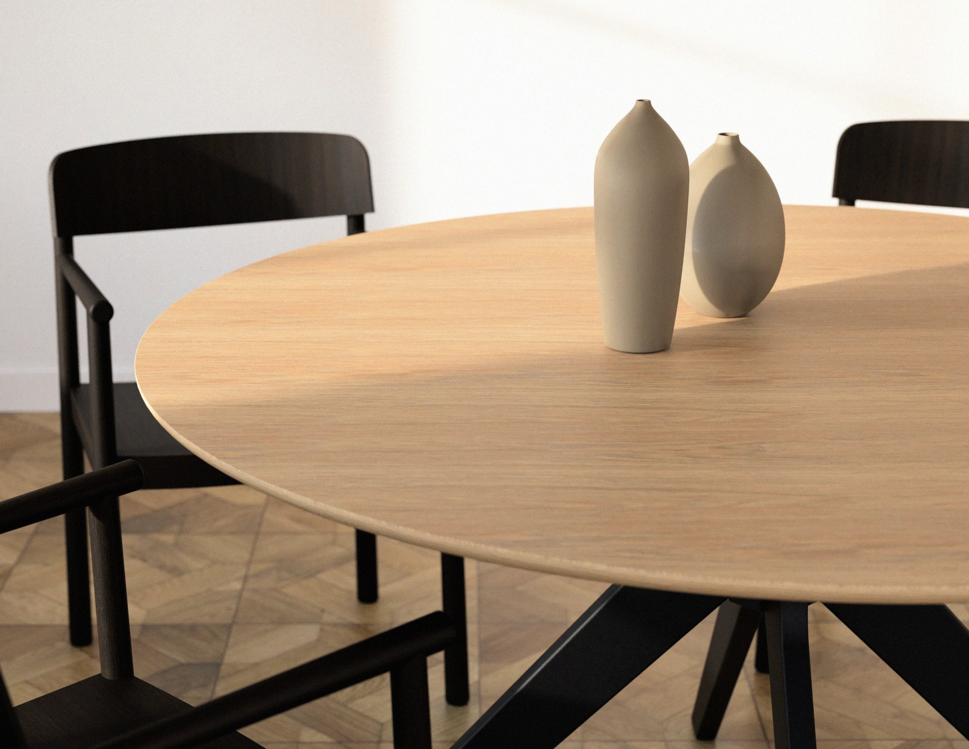 Round oak dining table with natural finish and arched frame, showcasing a smooth, circular surface and elegant wooden design.