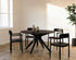 Round walnut dining table with an arched frame, showcasing a sleek, modern design perfect for dining rooms.