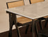 Natural oak rectangular dining table with four-legged frame, ideal for modern dining rooms, by My Store.