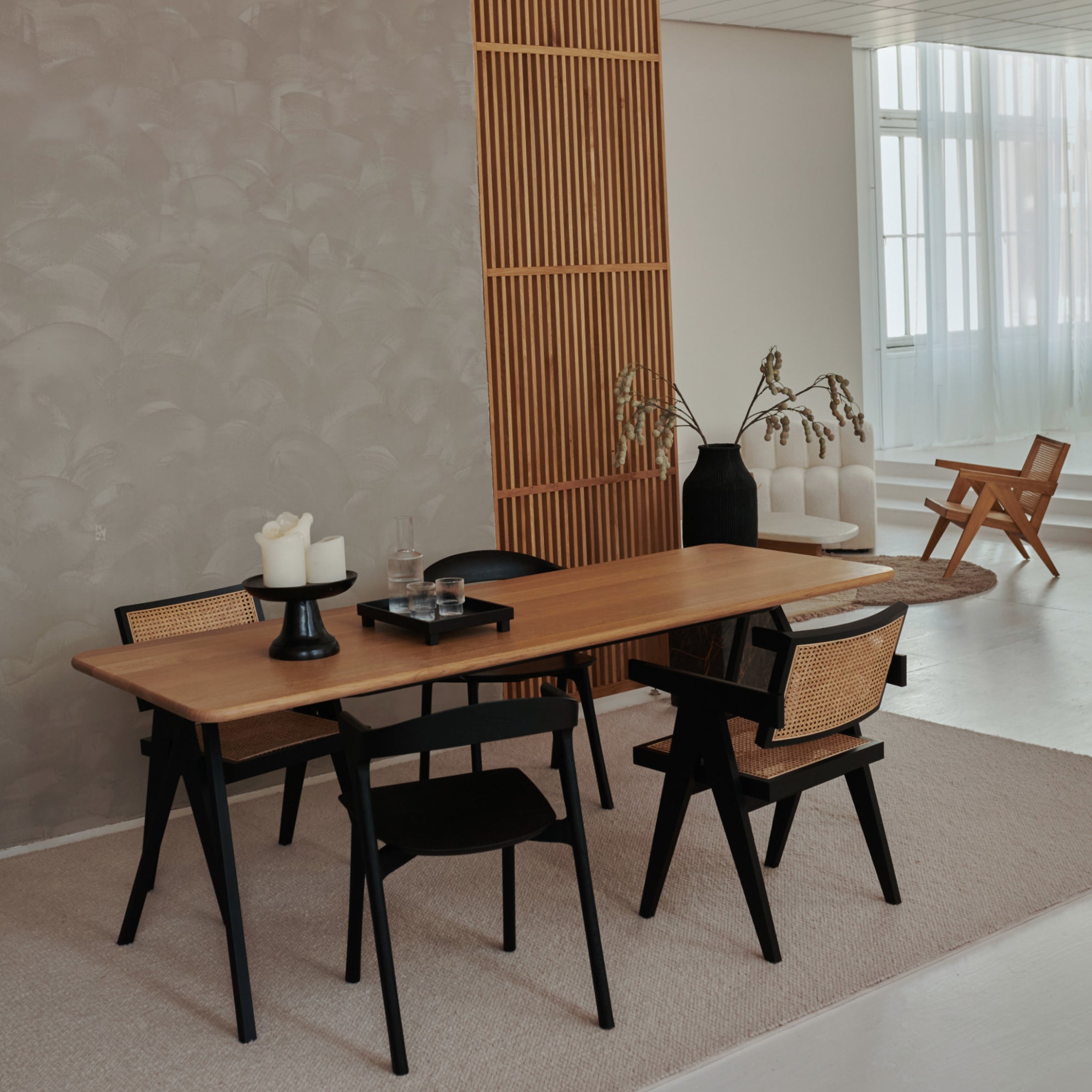 Rectangular oak dining table with natural finish and V-frame design, ideal for modern dining rooms.
