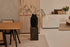 Rectangular oak dining table with natural finish and V-frame design, ideal for modern dining rooms.
