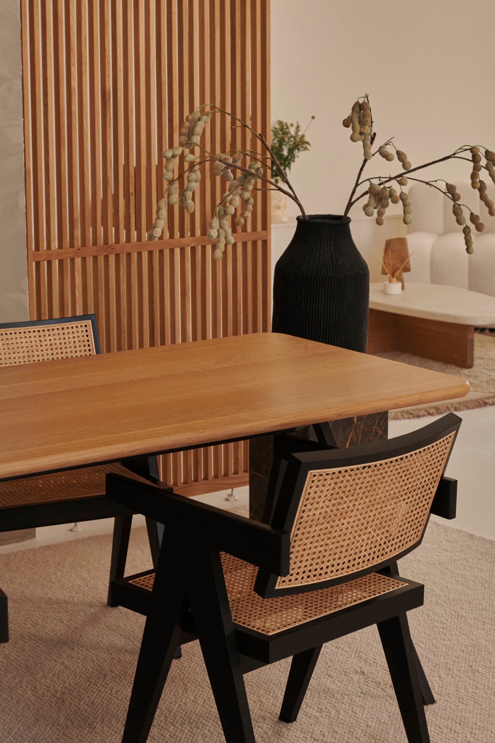 Rectangular oak dining table with natural finish and V-frame design, ideal for contemporary dining rooms.