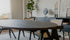 Oval walnut dining table with V-frame legs, 160 cm long, showcasing a sleek and modern design for dining room decor.