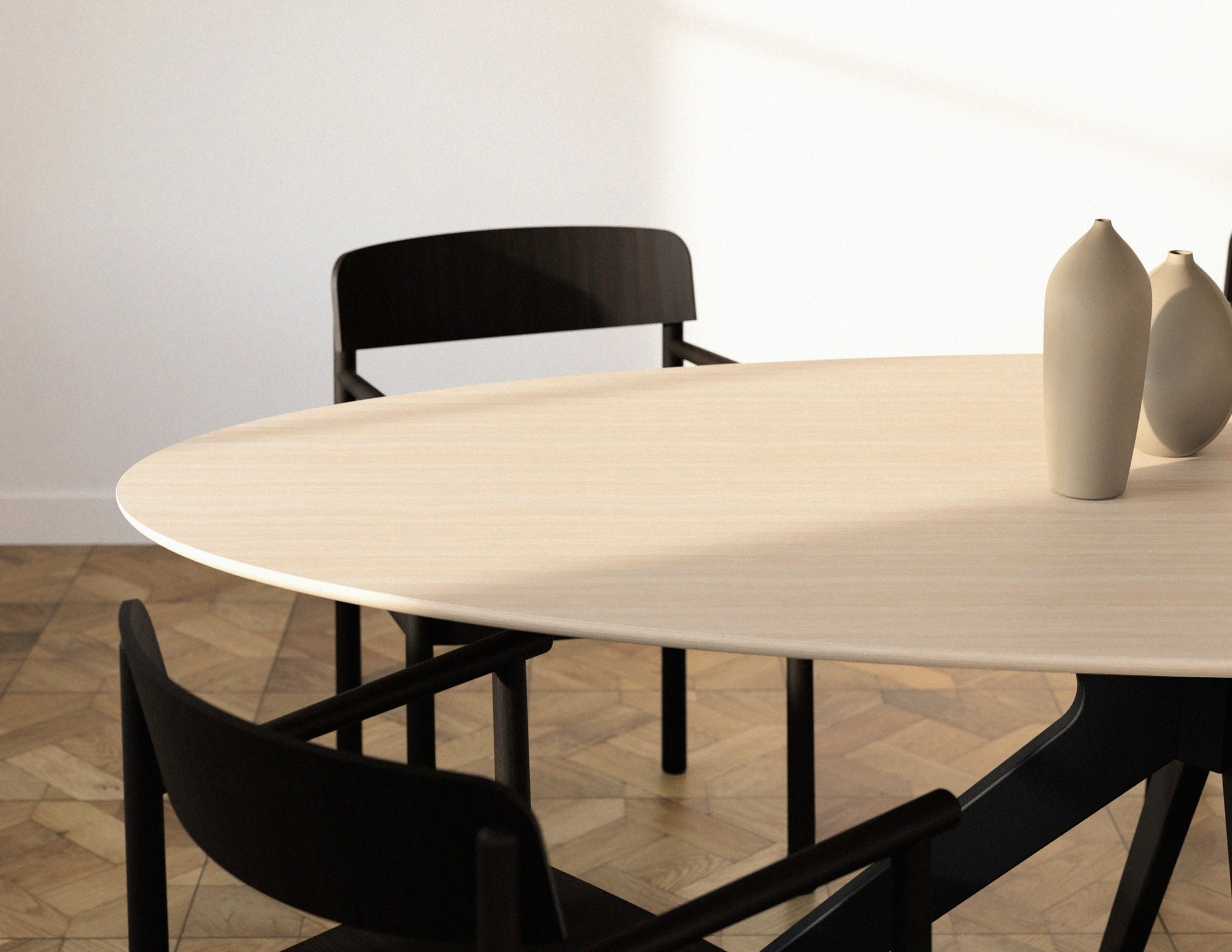 Oval oak dining table with ash white finish and arched frame, showcasing a sleek, modern design for contemporary dining rooms.