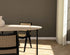 Oval oak dining table with ash white finish and cross frame design, showcasing a sleek, modern wooden dining surface.