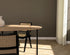 Oval oak dining table with natural finish and cross frame design, showcasing a sturdy wooden dining table in a modern style.