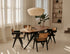 Smoked oval oak dining table with arched frame, showcasing smooth wood surface and elegant design in a modern dining room setting.
