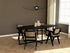 Smoked oak oval dining table with cross frame, showcasing a sleek, modern design and sturdy construction.
