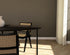 Oval oak dining table with smoked finish and cross frame design, showcasing a sleek and modern dining room setup.