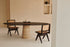 Oval FLOW dining table in smoked oak with travertin cylinder base, modern and sleek design by My Store.