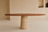 Oval walnut FLOW dining table with travertin cylinder base, modern design, 180x90 cm, crafted by My Store.